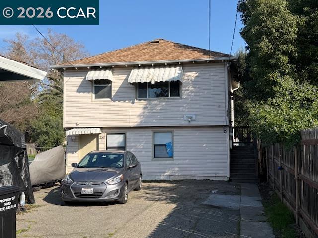 a front view of a house with parking space