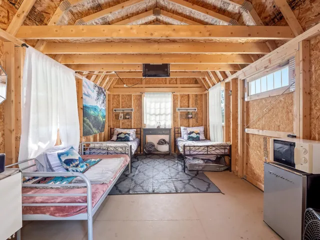 a view of a two chairs in the balcony