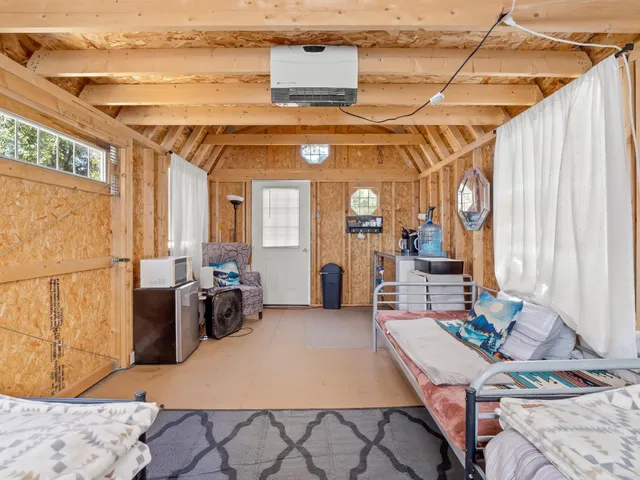 a view of backyard with sitting area