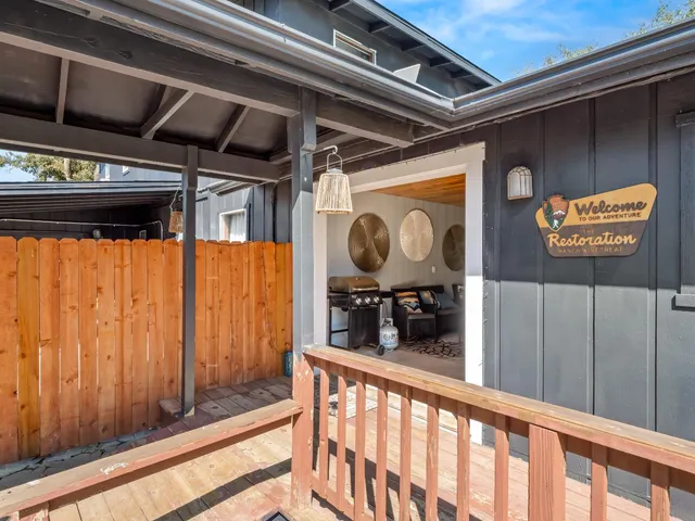 a workspace with wooden floor and white walls
