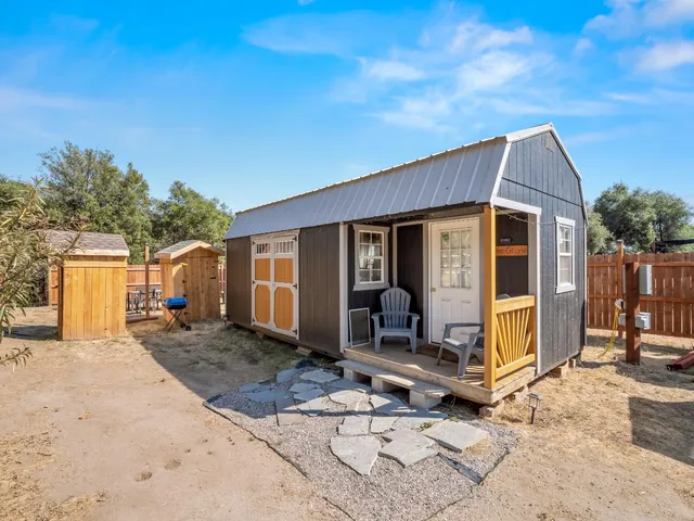 a spacious bedroom with a large bed and a fireplace