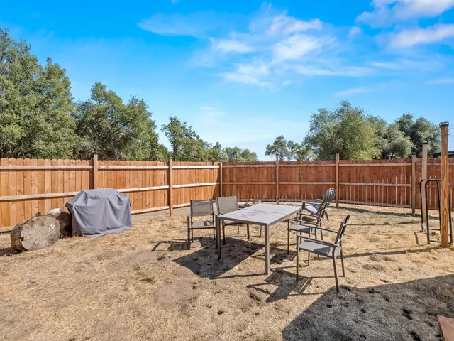 a spacious bedroom with a bed and a couch