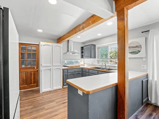 a view of a mountain range with lush green forest