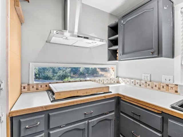 a view of a mountain range with lush green forest