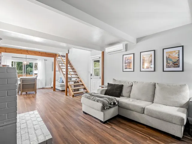 a bedroom with a bed and a book shelf