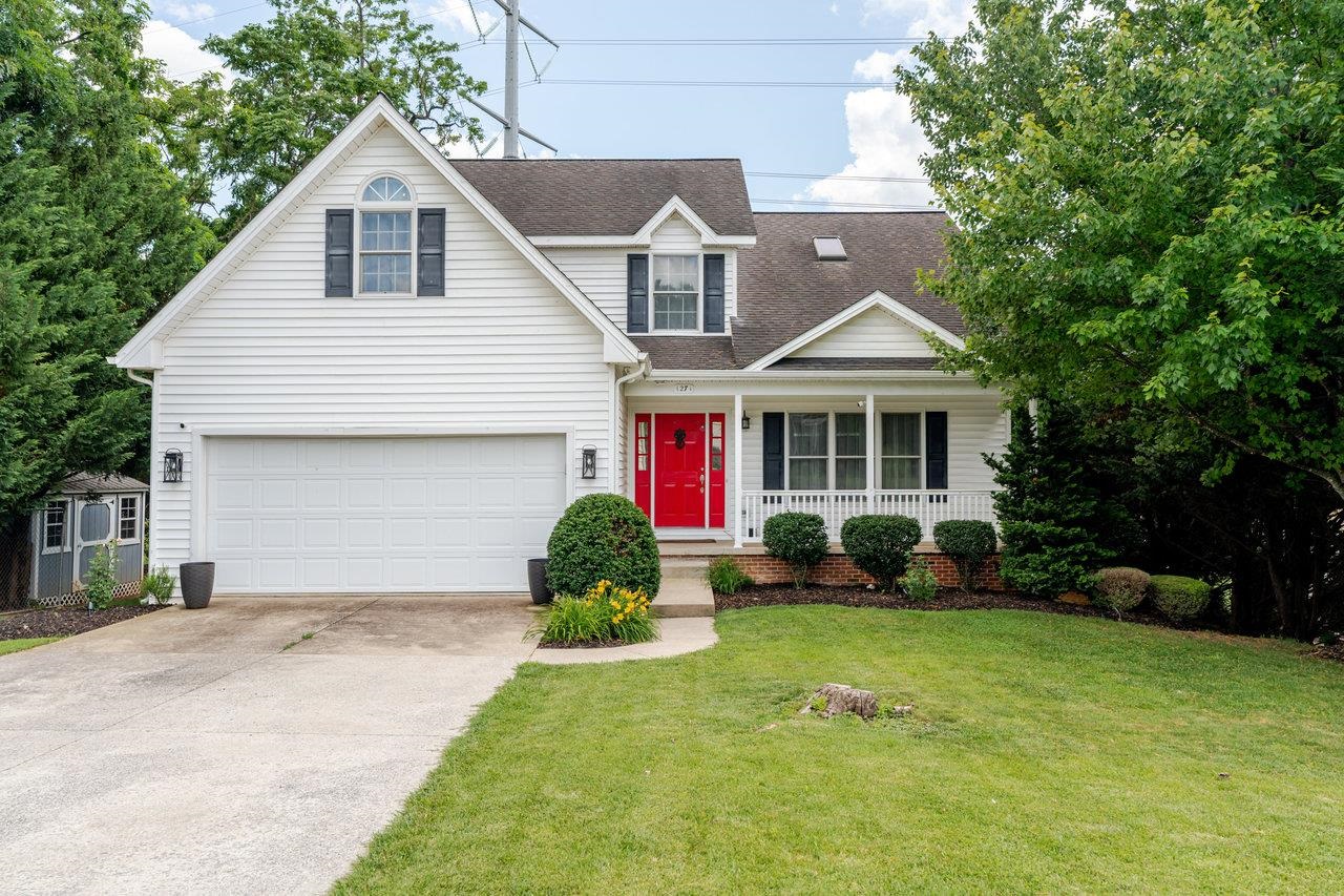 1271 King Edwards Way Harrisonburg, VA 22801 - Photo 1 of 75 a front view of a house with a yard and garage