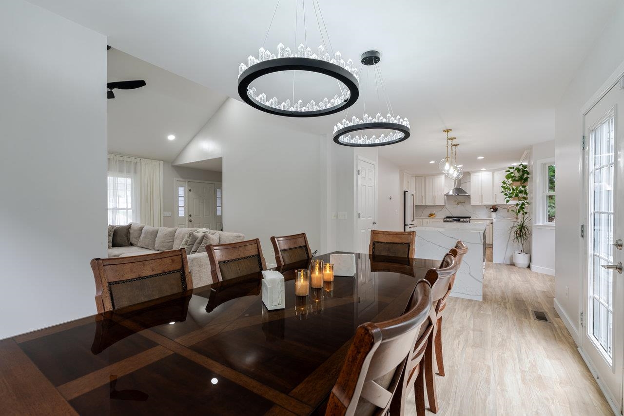 1271 King Edwards Way Harrisonburg, VA 22801 - Photo 13 of 75 a view of a dining room with furniture a chandelier and wooden floor