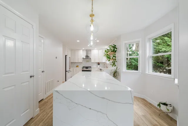 a close view of a stove a microwave and cabinets in the kitchen