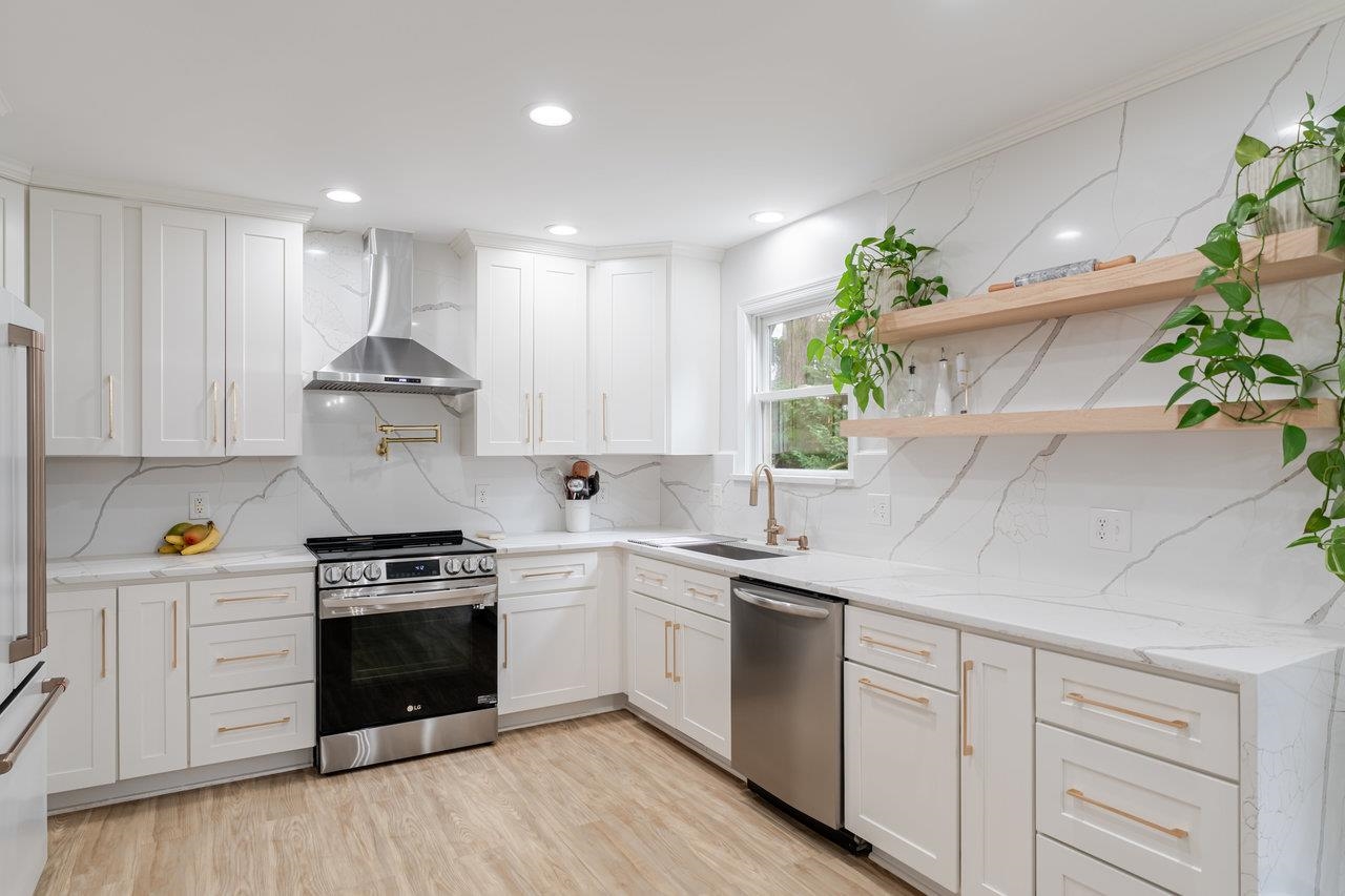 1271 King Edwards Way Harrisonburg, VA 22801 - Photo 20 of 75 a kitchen with a white stove top oven and white cabinets with wooden floor