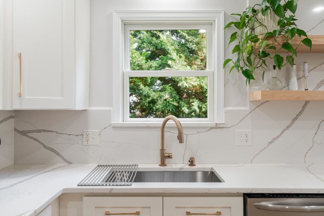 1271 King Edwards Way Harrisonburg, VA 22801 - Photo 25 of 75 a kitchen with a sink a window and a potted plant
