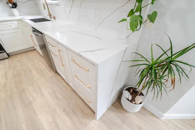 a view of walk in closet with clothes