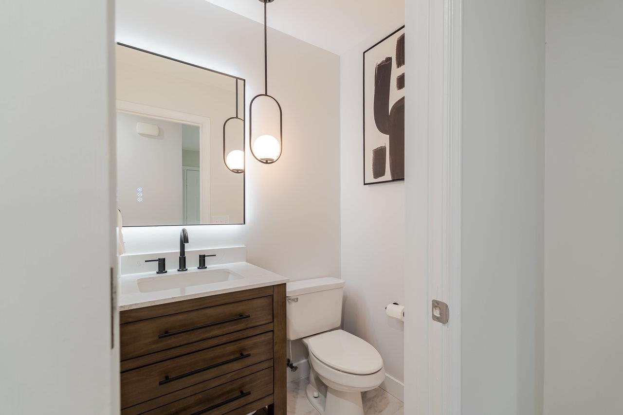 1271 King Edwards Way Harrisonburg, VA 22801 - Photo 33 of 75 a bathroom with a toilet sink vanity and mirror