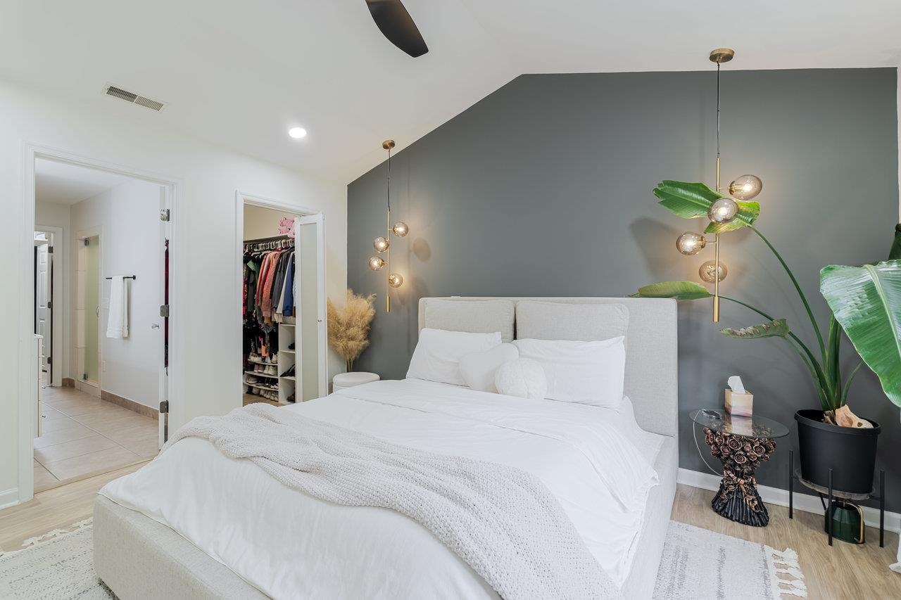 1271 King Edwards Way Harrisonburg, VA 22801 - Photo 37 of 75 a bedroom with a bed and a potted plant on the dresser