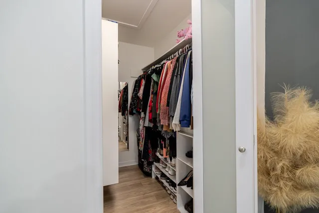 a room with lots of stuff and hardwood floor