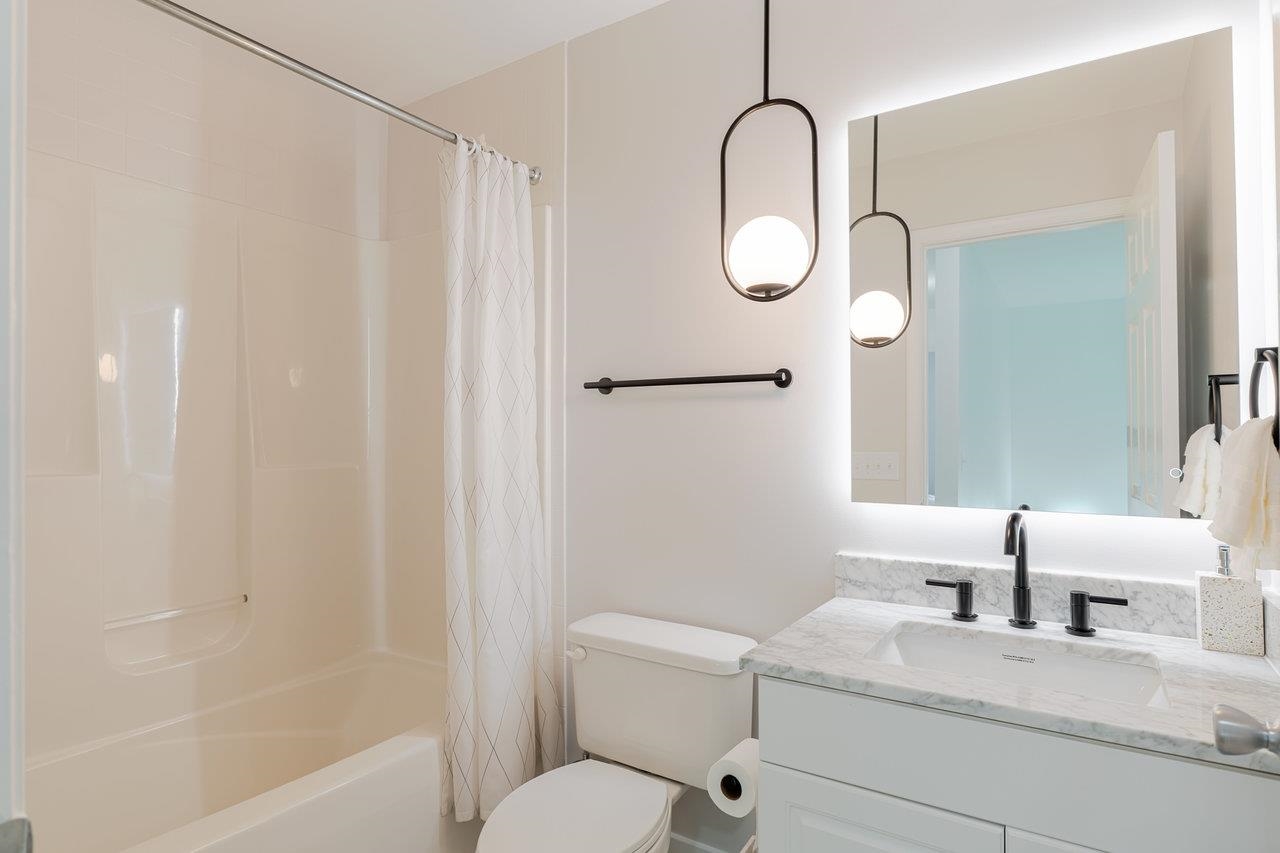 1271 King Edwards Way Harrisonburg, VA 22801 - Photo 58 of 75 a bathroom with a granite countertop sink mirror vanity and toilet