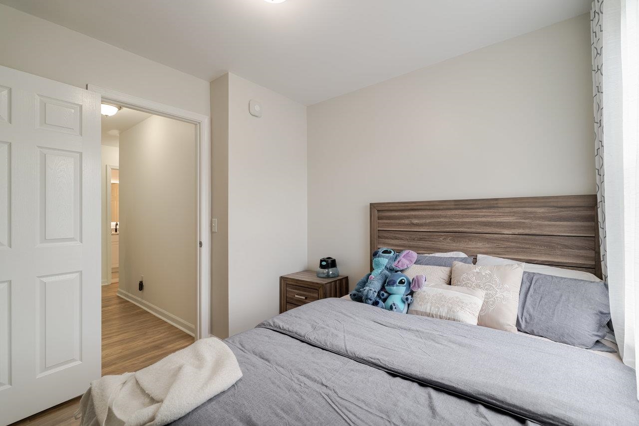 1271 King Edwards Way Harrisonburg, VA 22801 - Photo 61 of 75 a bedroom with a bed and wooden floor