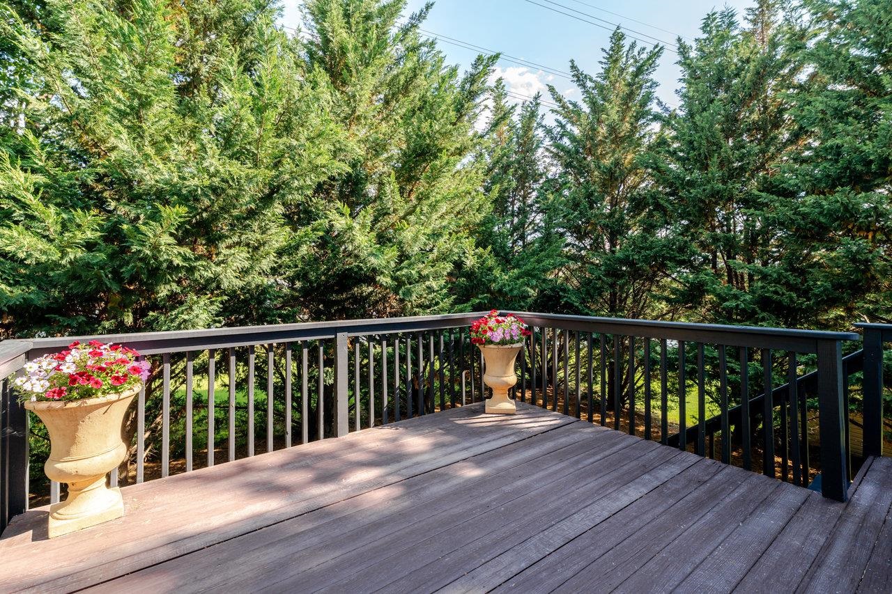 1271 King Edwards Way Harrisonburg, VA 22801 - Photo 72 of 75 a balcony with wooden floor and trees in the background