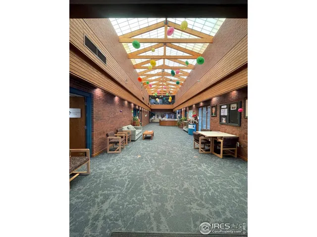 a view of living room with a table and chairs