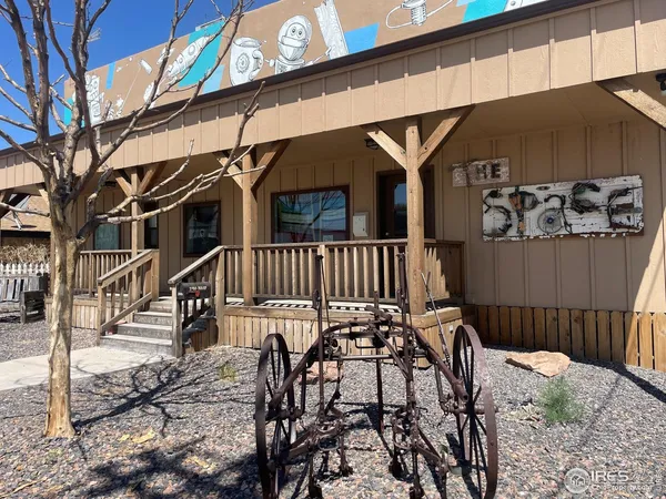 a view of a chairs and table in the patio