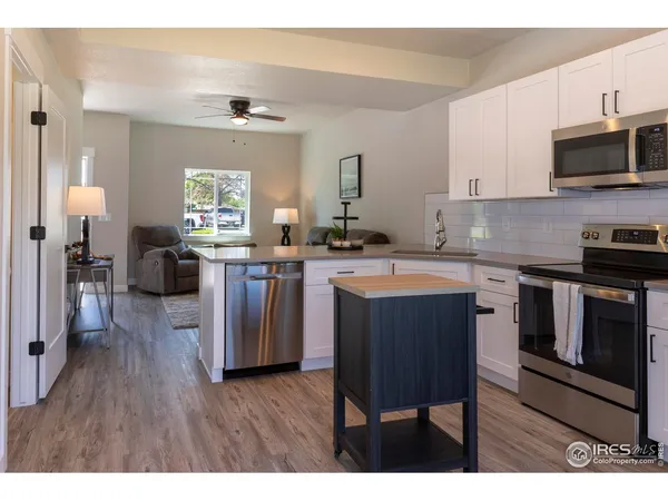 a kitchen with a sink cabinets and stainless steel appliances