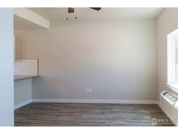 a view of an empty room and window