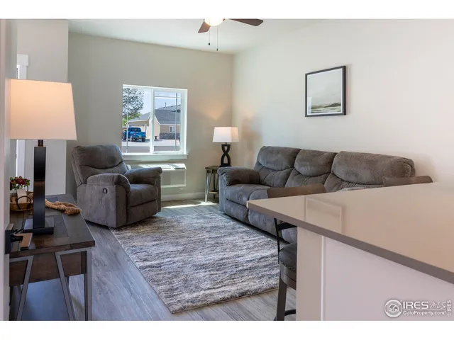 a living room with furniture and a window