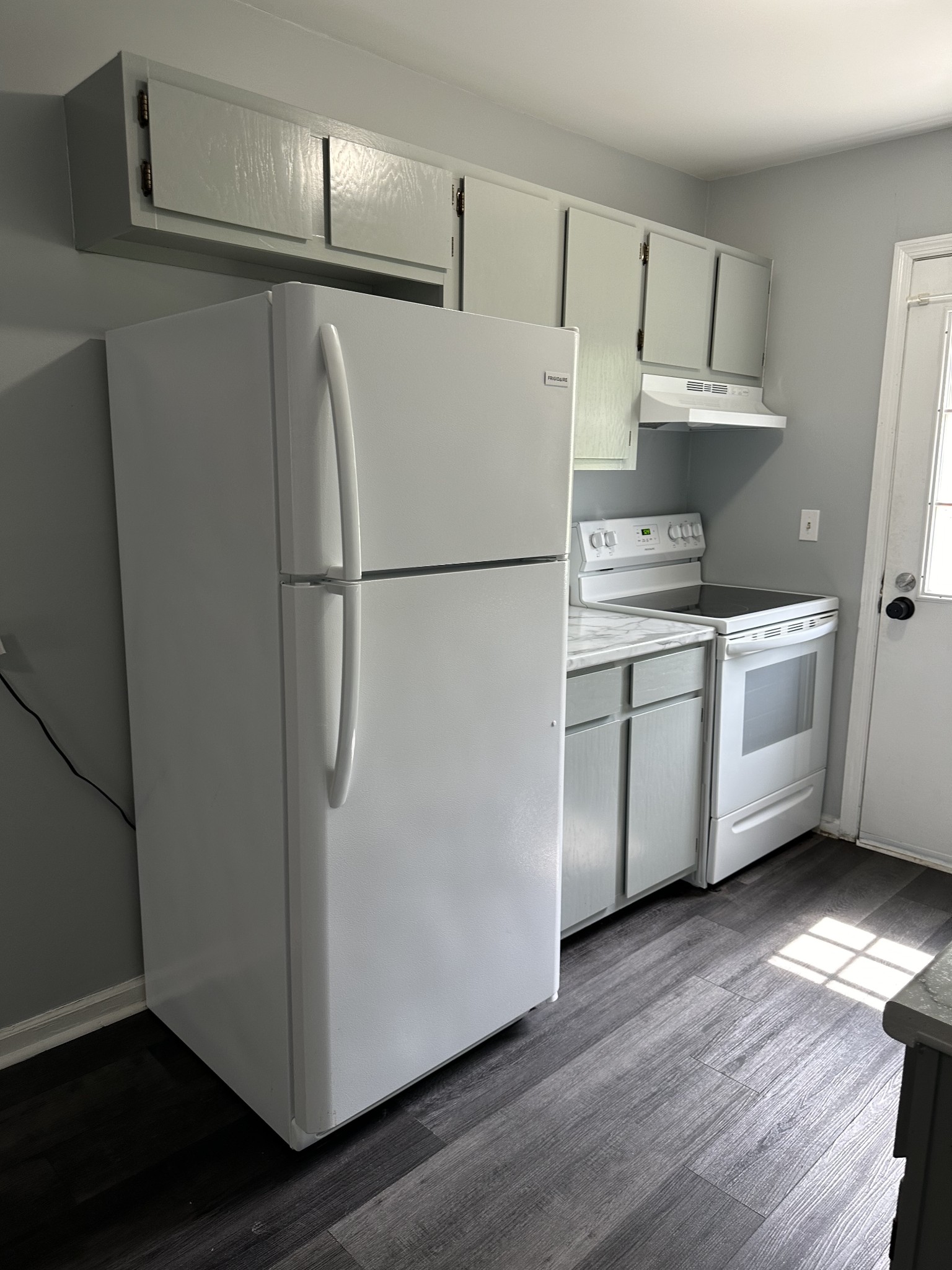 1301 Neelys Bend Road, Unit 52 Madison, TN 37115 - Photo 4 of 16 a white refrigerator freezer sitting inside of a kitchen