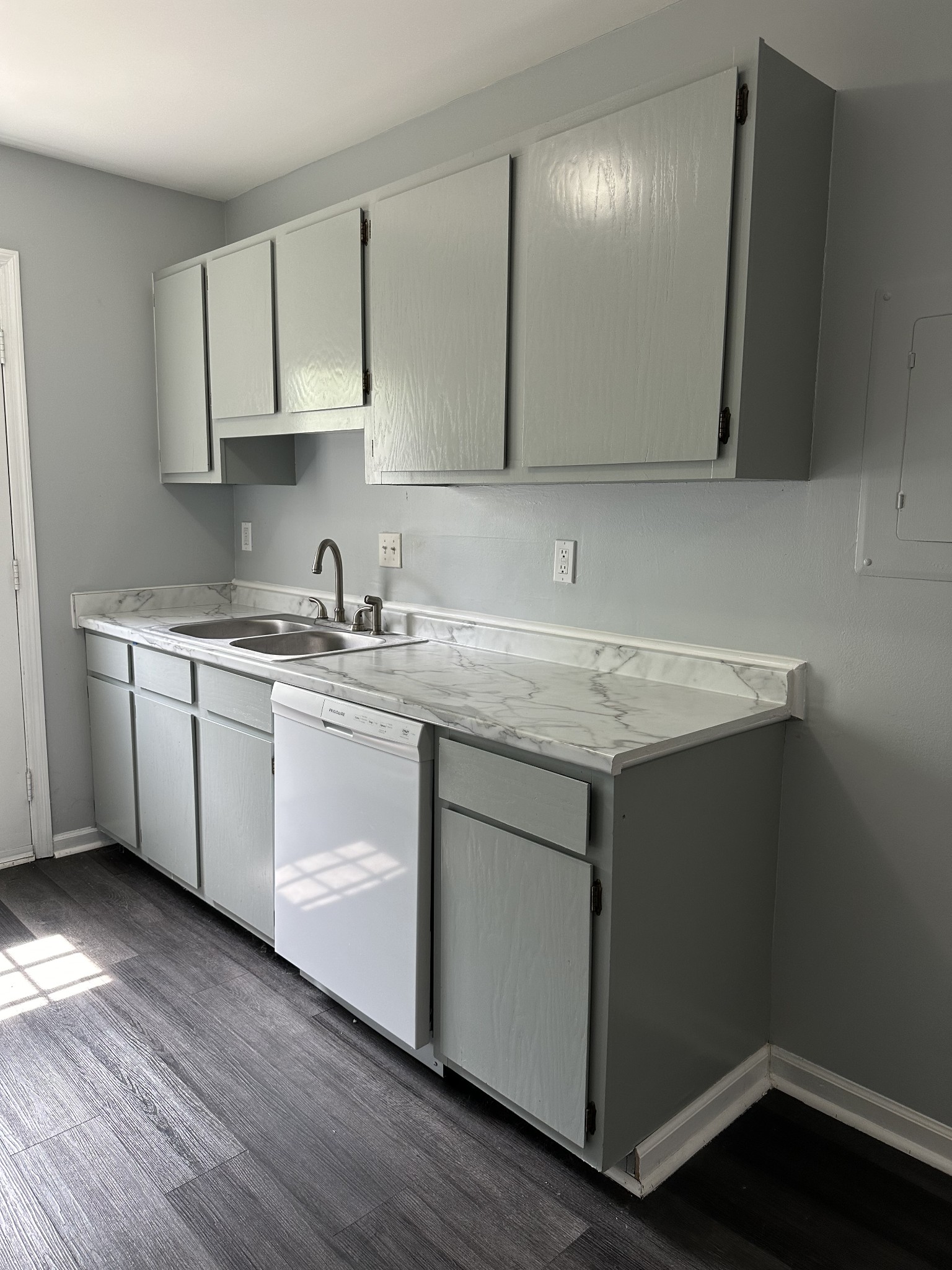 1301 Neelys Bend Road, Unit 52 Madison, TN 37115 - Photo 5 of 16 a kitchen with a sink cabinets and wooden floor