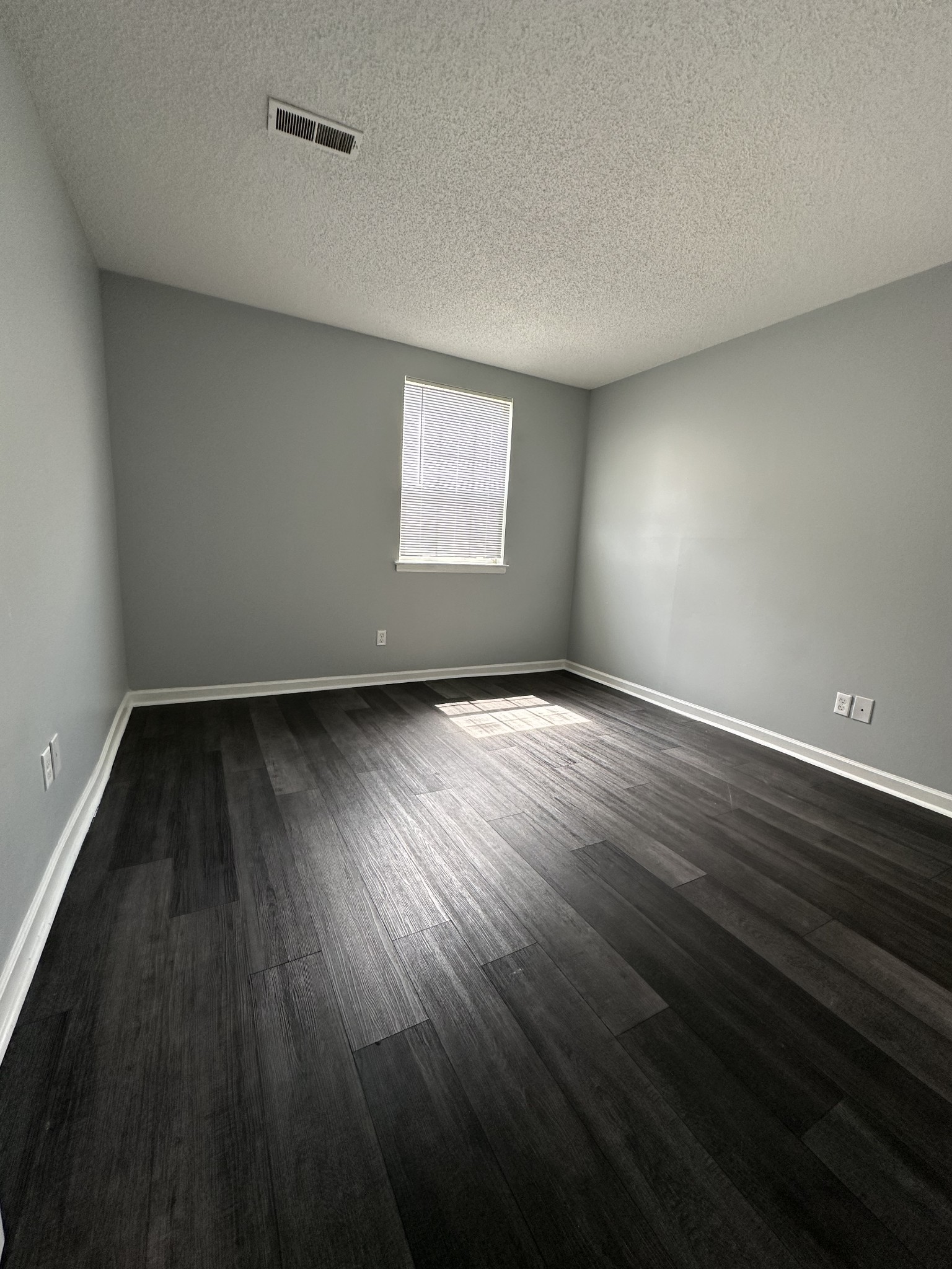 1301 Neelys Bend Road, Unit 52 Madison, TN 37115 - Photo 6 of 16 an empty room with wooden floor and windows