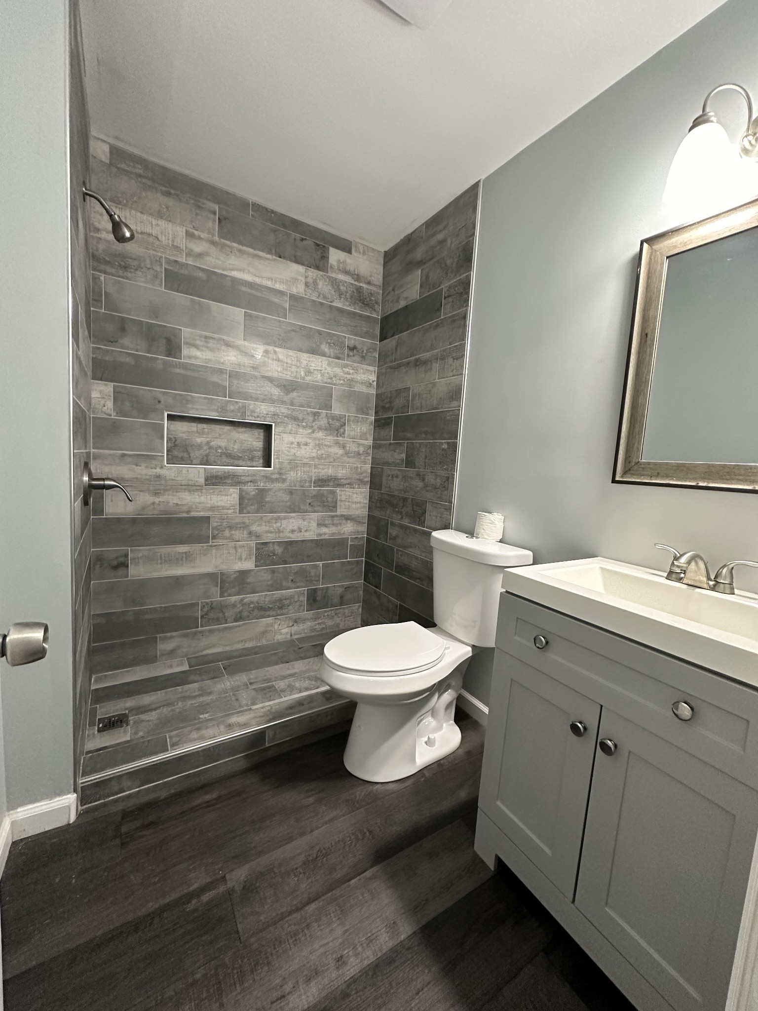 1301 Neelys Bend Road, Unit 52 Madison, TN 37115 - Photo 8 of 16 a bathroom with a granite countertop toilet a sink and a mirror
