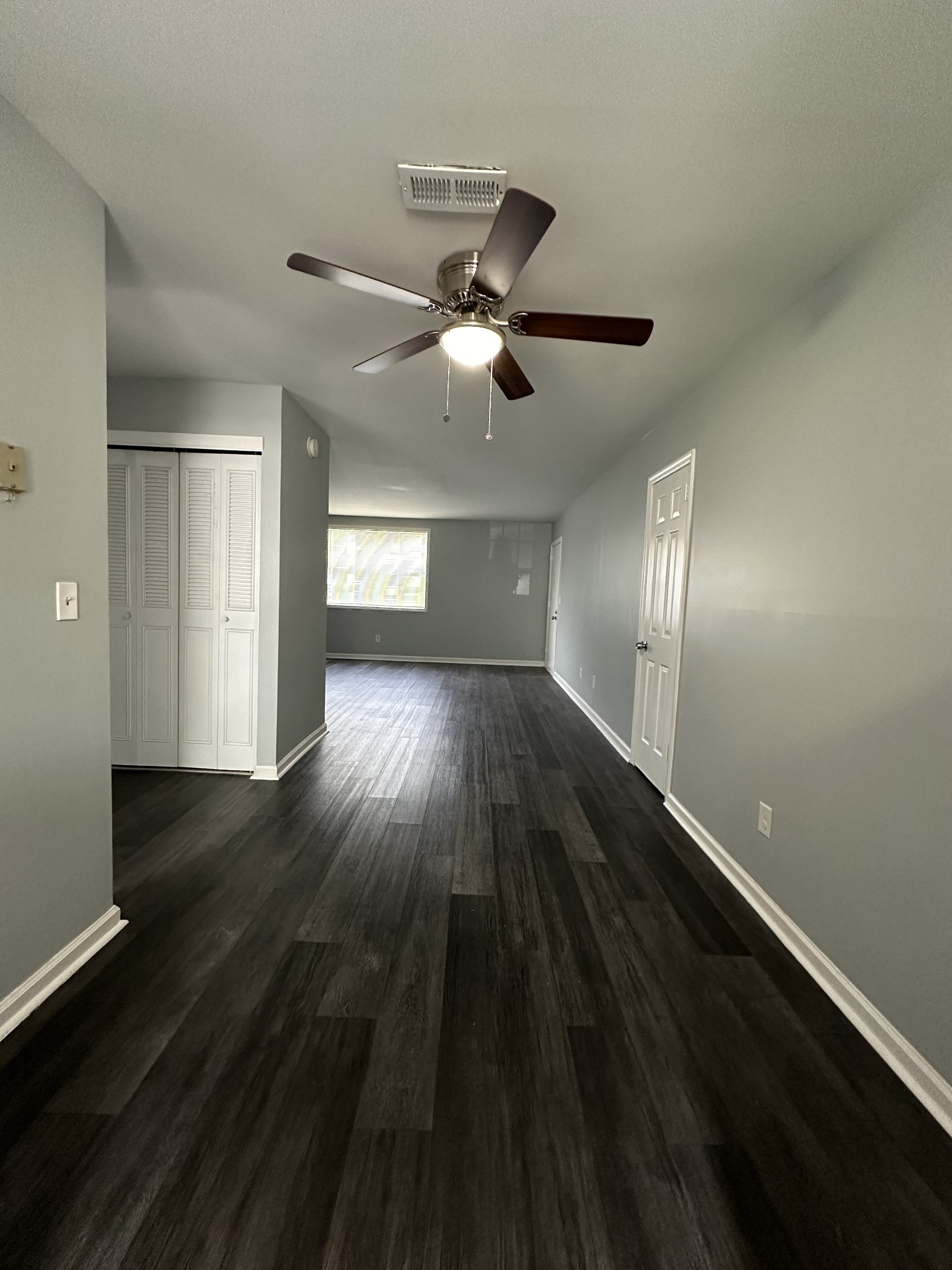 1301 Neelys Bend Road, Unit 52 Madison, TN 37115 - Photo 9 of 16 wooden floor in an empty room with a window