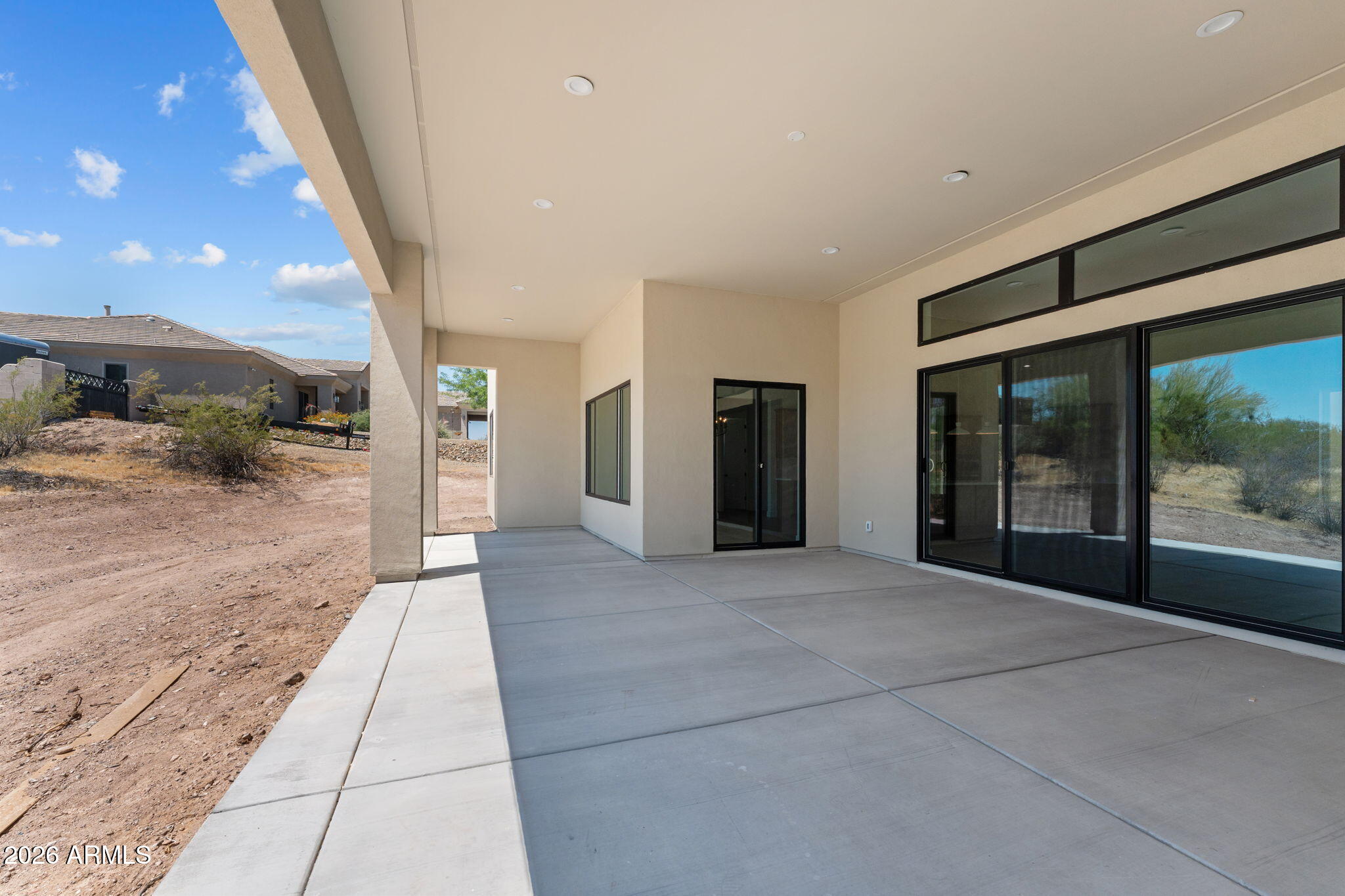 2855 Percheron Road Wickenburg, AZ 85390 - Photo 50 of 58 a view of hallway with a large window and chandelier