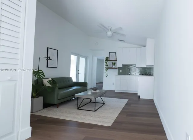 a living room with furniture and a rug