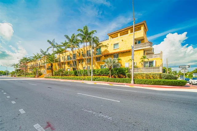 a view of a street with a building in the background
