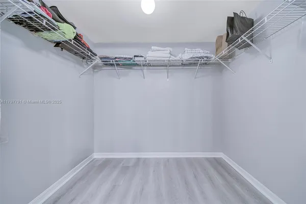 an empty room with windows and entrance