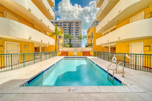 a view of a swimming pool with a sink and pool