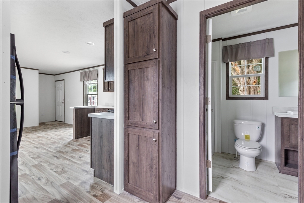 4 Sam Street Acushnet, MA 02743 - Photo 5 of 10 a view of bathroom with a toilet sink and a mirror