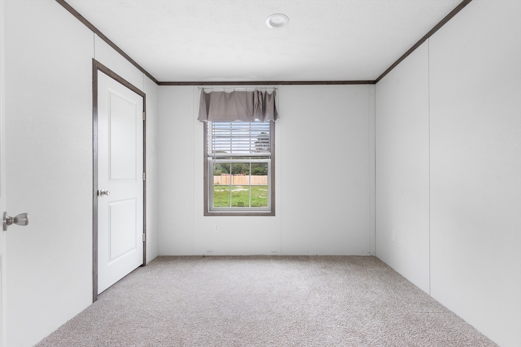 4 Sam Street Acushnet, MA 02743 - Photo 8 of 10 an empty room with windows and closet
