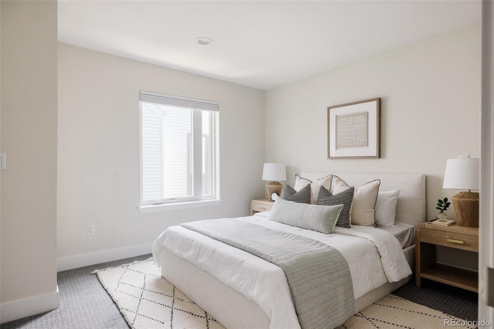 1179 South Reed Street Lakewood, CO 80232 - Photo 13 of 27 a bedroom with a bed and window