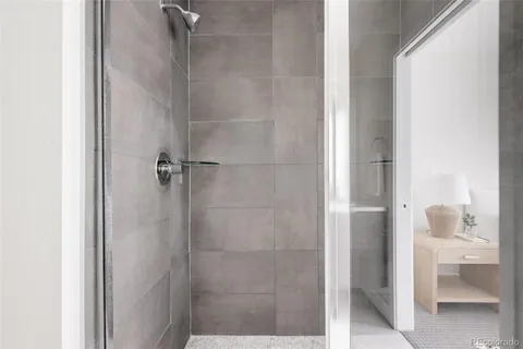 a bathroom with a glass shower door