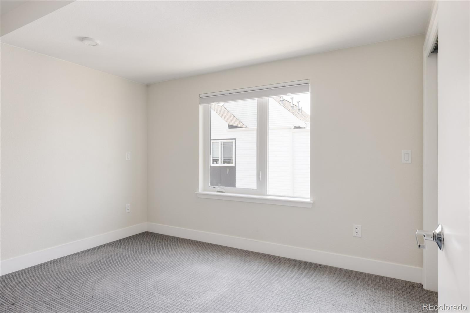 1179 South Reed Street Lakewood, CO 80232 - Photo 18 of 27 an empty room with a window