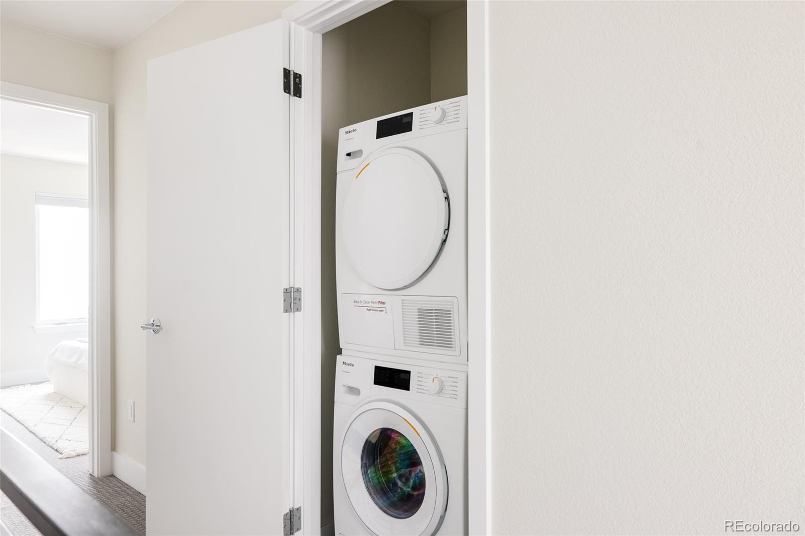 1179 South Reed Street Lakewood, CO 80232 - Photo 22 of 27 a utility room with dryer and washer