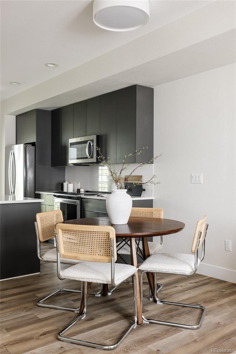 1179 South Reed Street Lakewood, CO 80232 - Photo 8 of 27 a view of a dining room with furniture
