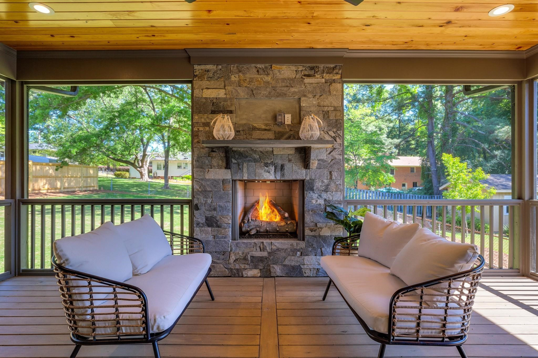 115 Crestview Road Raleigh, NC 27609 - Photo 3 of 42 a balcony with furniture and a fireplace