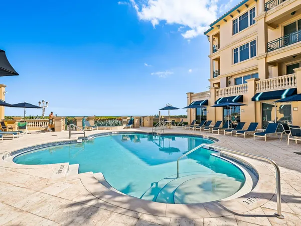 a view of a swimming pool with a seating space