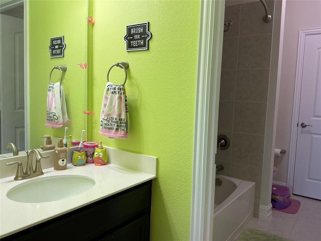 2344 Candler Club Way Little Elm, TX 75068 - Photo 10 of 14 a bathroom with a sink and a mirror