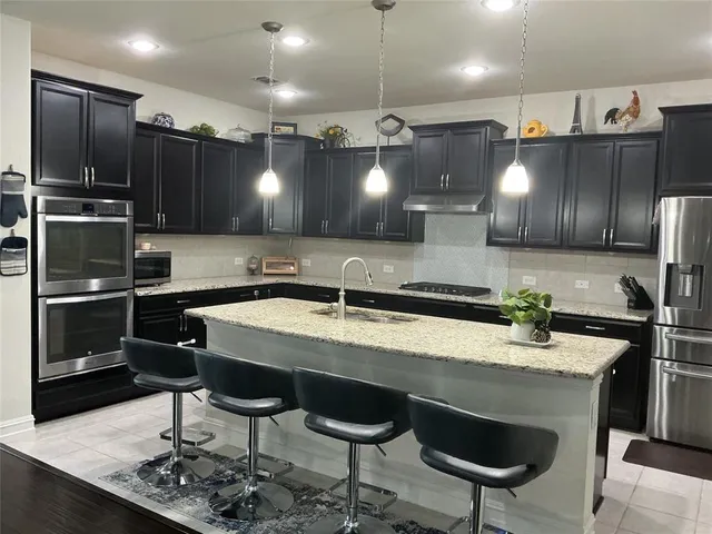 a view of a backyard with a slide and a wooden fence