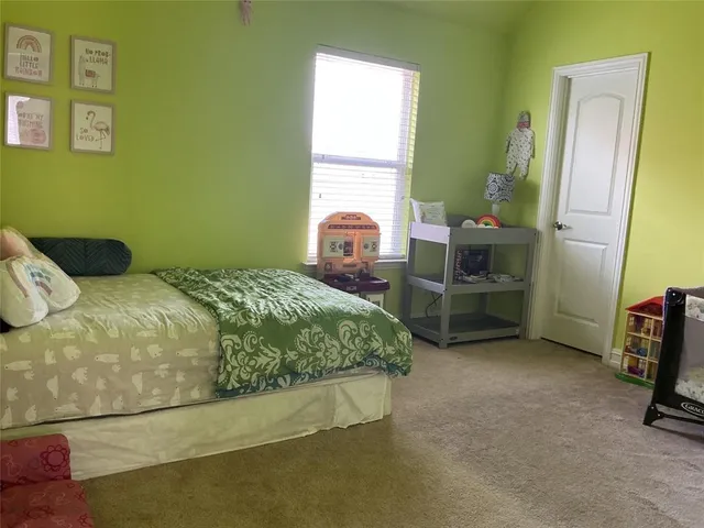 a bedroom with a bed and cabinets