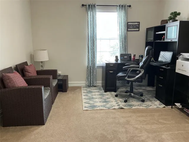 a bedroom with a bed and chair