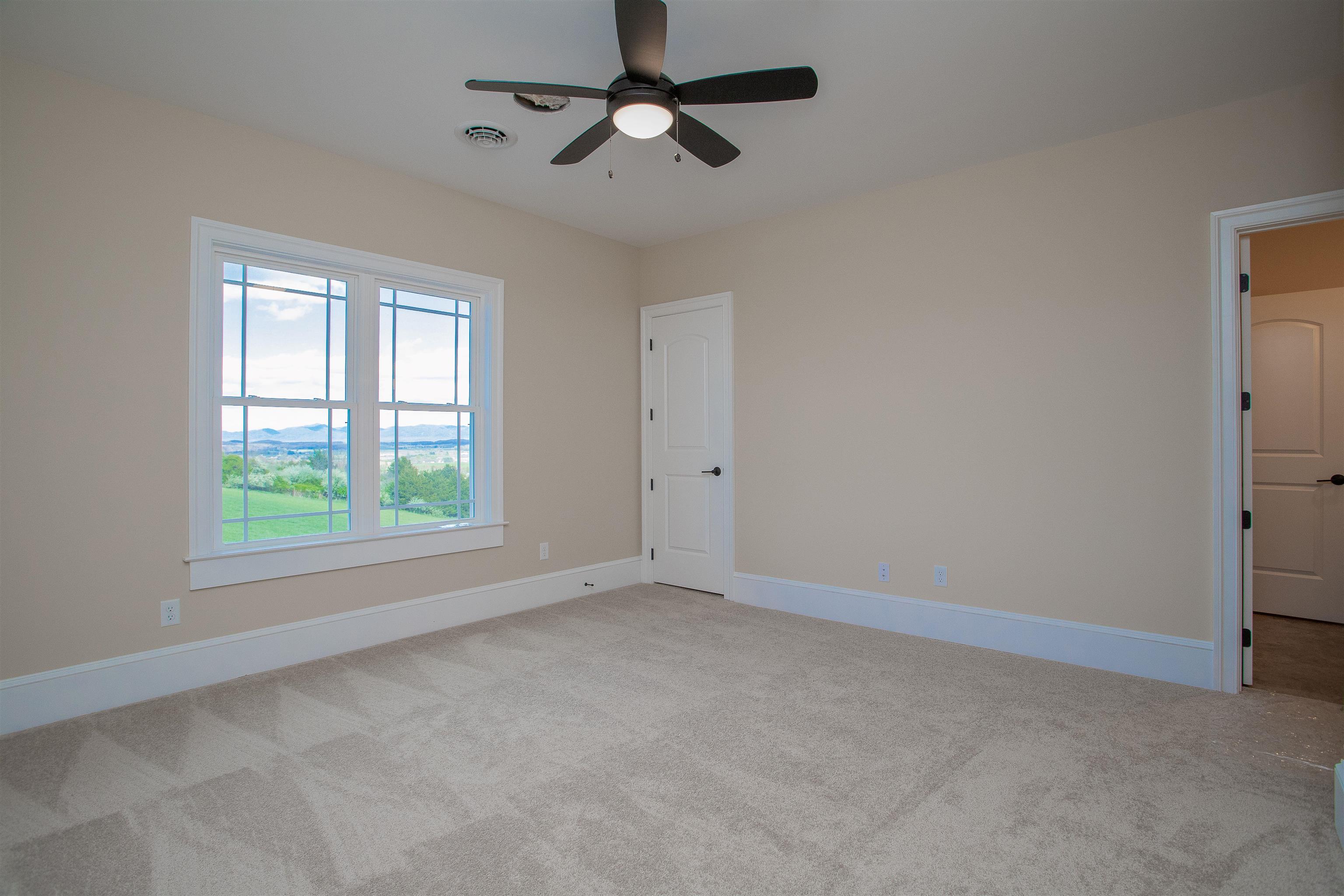 243 Barrenridge Road Fishersville, VA 22939 - Photo 58 of 75 an empty room with a window and a fan